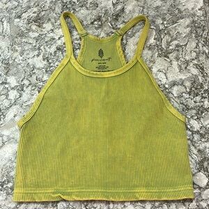 free people movement tank top, size xs, color is a greenish-yellow.